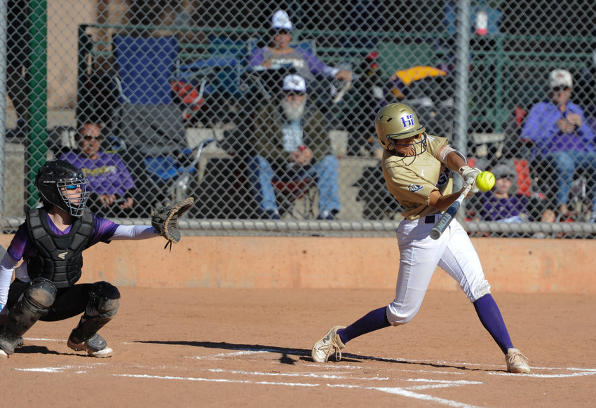 Holy Family freshman Isabella Arroyo strokes a home run against Denver North in a CHSAA 4A regional round playoff game at Broomfield Industrial Park Oct. 16. The Tigers easily defeated North, 15-0, and Berthoud 10-0, to reach the 4A state tournament.